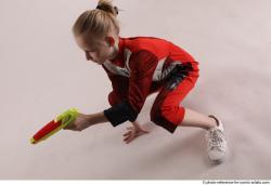 DENISA SITTING POSE WITH GUN